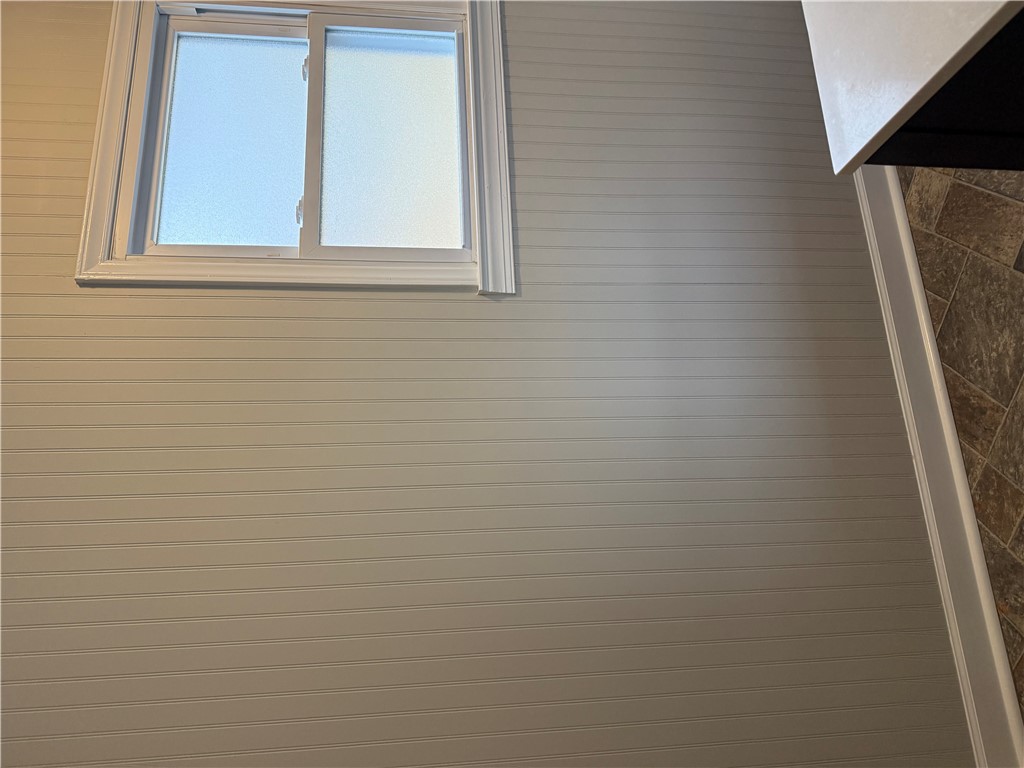 325 Circle Drive Pendleton, SC 29670 - Photo 20 of 21 This bright space features beadboard paneling and a large window, offering a clean, inviting aesthetic.