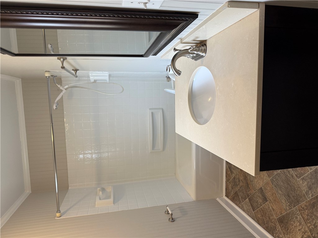 325 Circle Drive Pendleton, SC 29670 - Photo 21 of 21 This bright bathroom features a vanity with a sleek sink, offering everyday comfort.