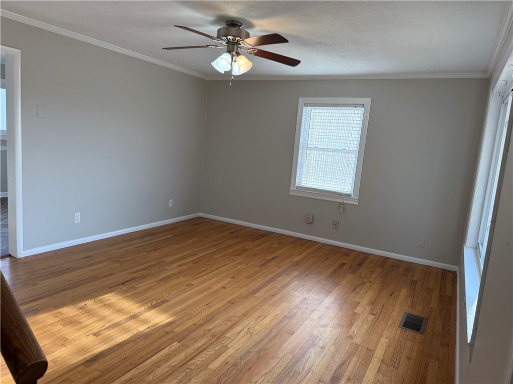 325 Circle Drive Pendleton, SC 29670 - Photo 3 of 21 This airy room features hardwood flooring and bright windows, creating a welcoming atmosphere.