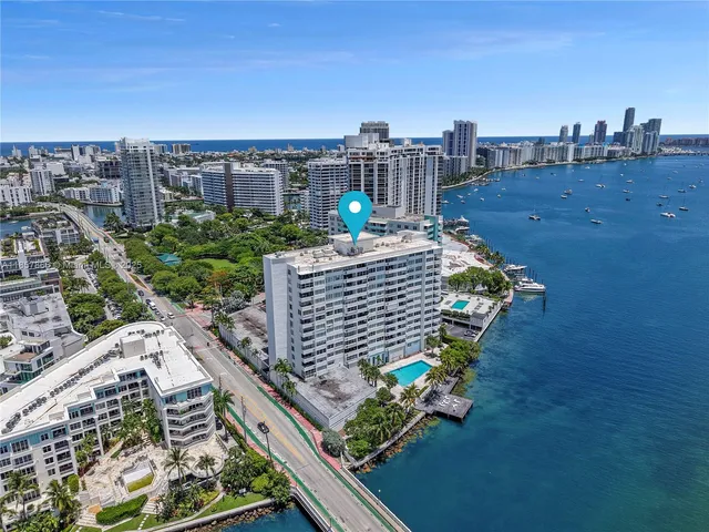 a view of a street with palm trees