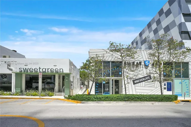 a front view of a building with garden