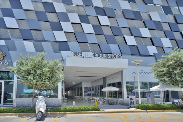 a view of a building with a palm tree