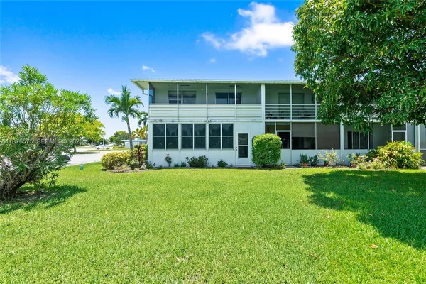 front view of a house with a garden