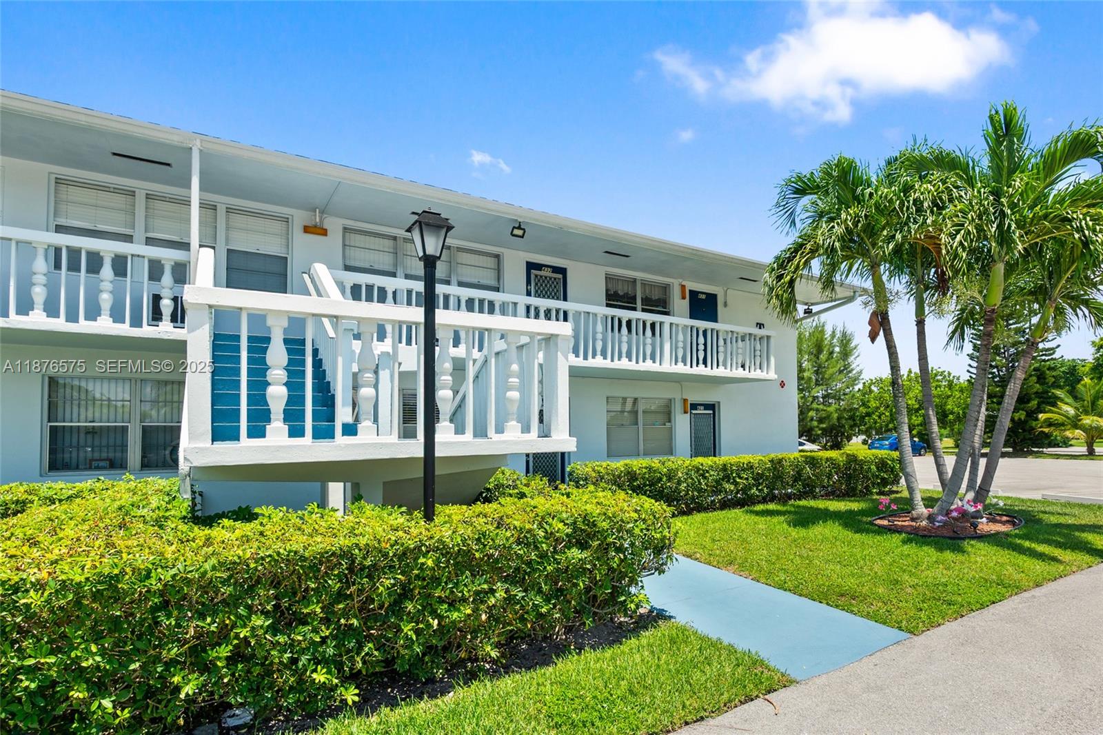 431 Markham South, Unit 431 Deerfield Beach, FL 33442 - Photo 21 of 30 a front view of a house with a yard