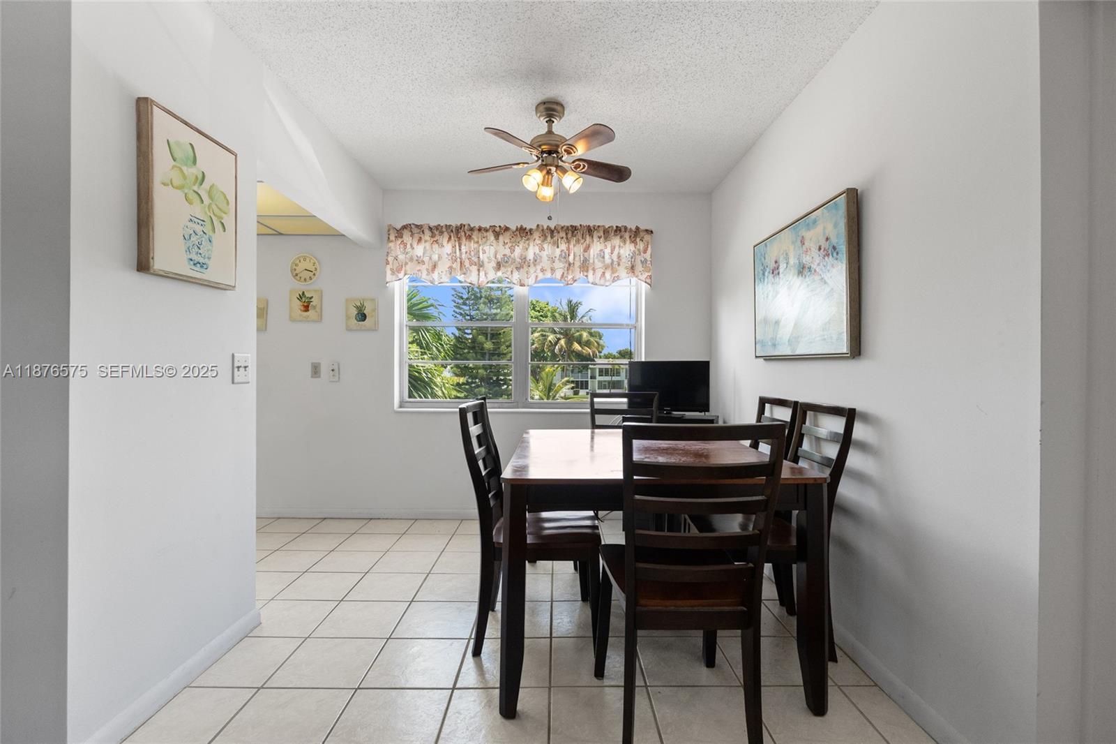 431 Markham South, Unit 431 Deerfield Beach, FL 33442 - Photo 5 of 30 a view of a dining room with furniture window and outside view