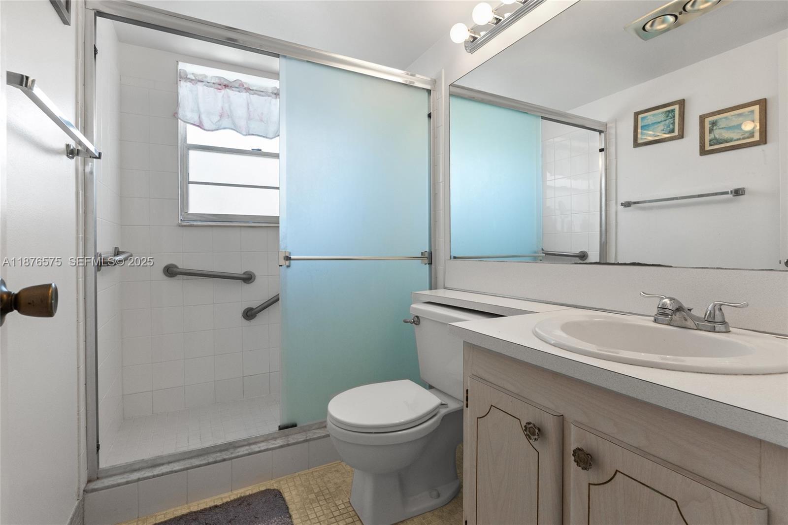 431 Markham South, Unit 431 Deerfield Beach, FL 33442 - Photo 7 of 30 a bathroom with a sink a toilet and shower