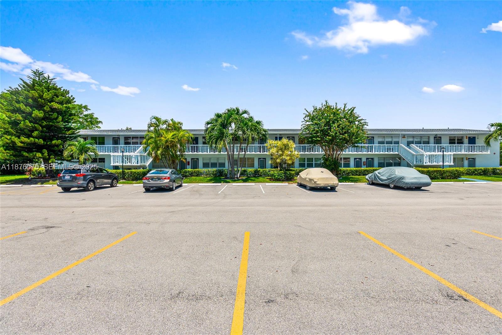 431 Markham South, Unit 431 Deerfield Beach, FL 33442 - Photo 8 of 30 a view of street with parked cars