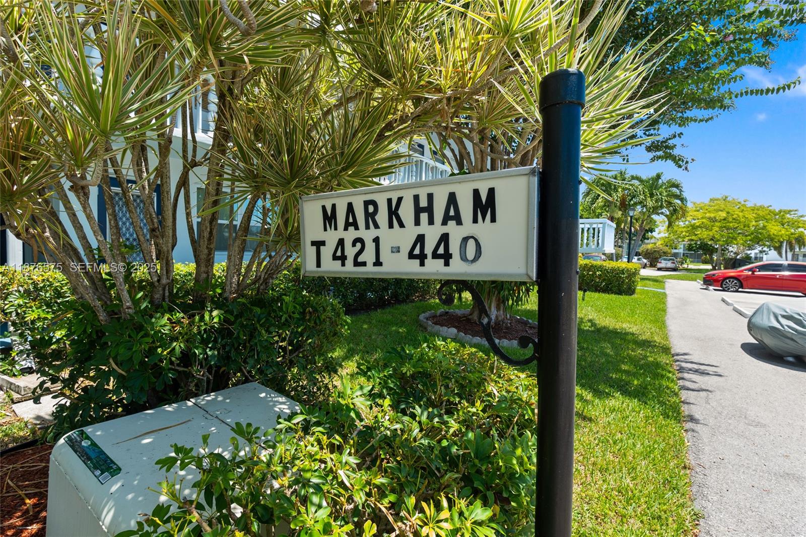 431 Markham South, Unit 431 Deerfield Beach, FL 33442 - Photo 10 of 30 a sign on the side of the road