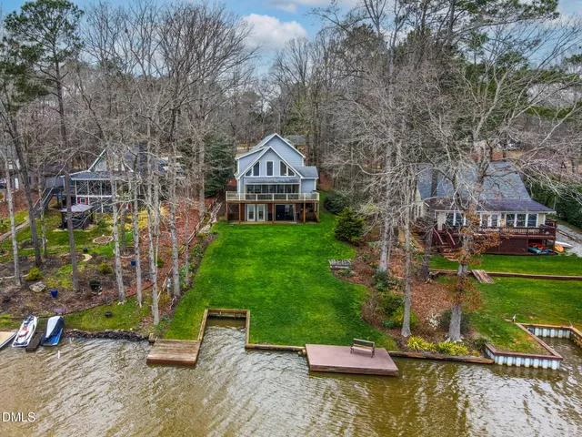 an aerial view of a house with a yard table and chairs