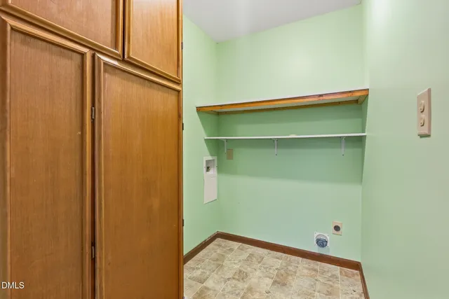a view of an empty room with a ceiling fan