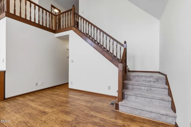 a view of an empty room with a ceiling fan