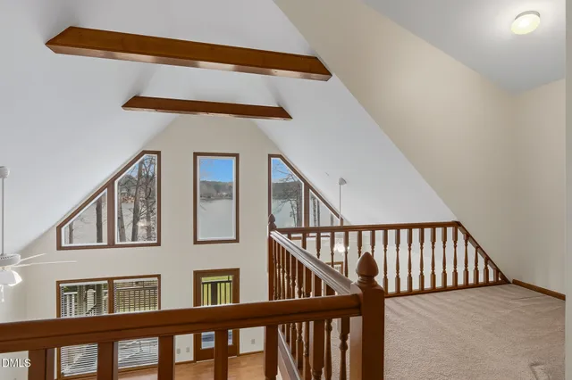 a view of a livingroom with a ceiling fan and window