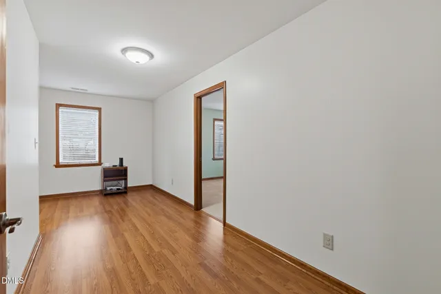 an aerial view of a house with a lake view