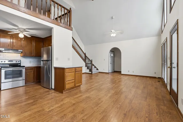 a view of an empty room with glass door