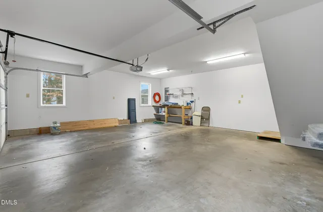 an aerial view of a house with yard swimming pool and outdoor seating