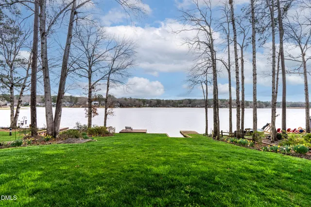 a view of a swimming pool with a yard