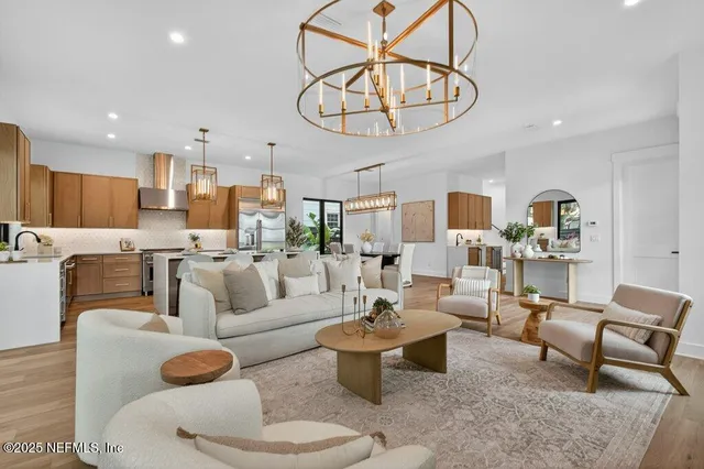 a kitchen with a sink a table and chairs