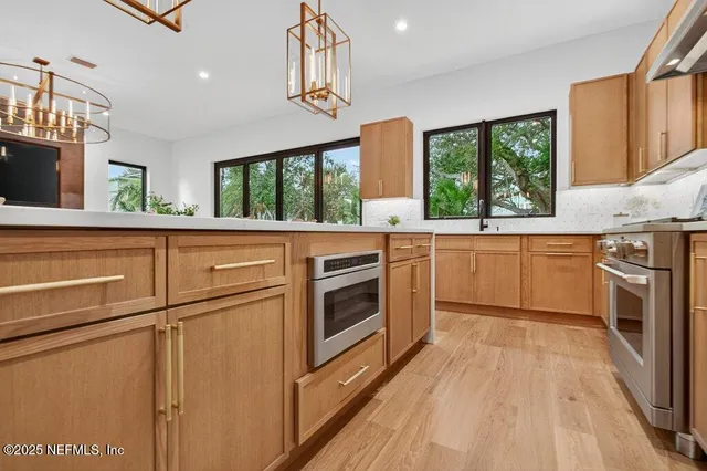 a outdoor dining space with furniture and outdoor kitchen