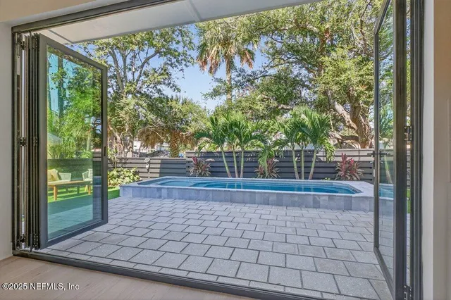 a bedroom with a bed and a dresser with mirror