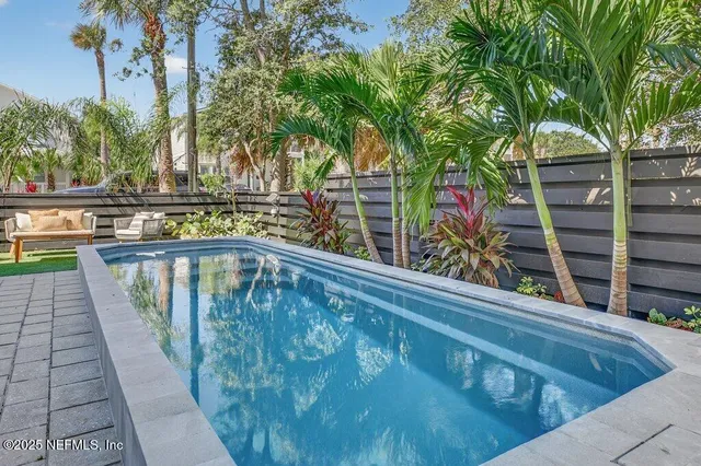 a spacious bathroom with a granite countertop sink mirror and shower