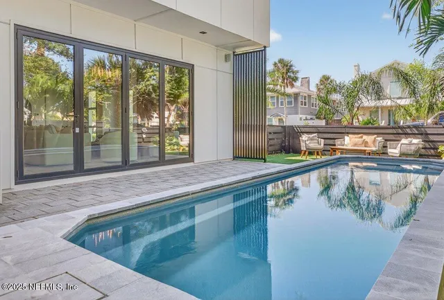 a bedroom with a bed and a potted plant