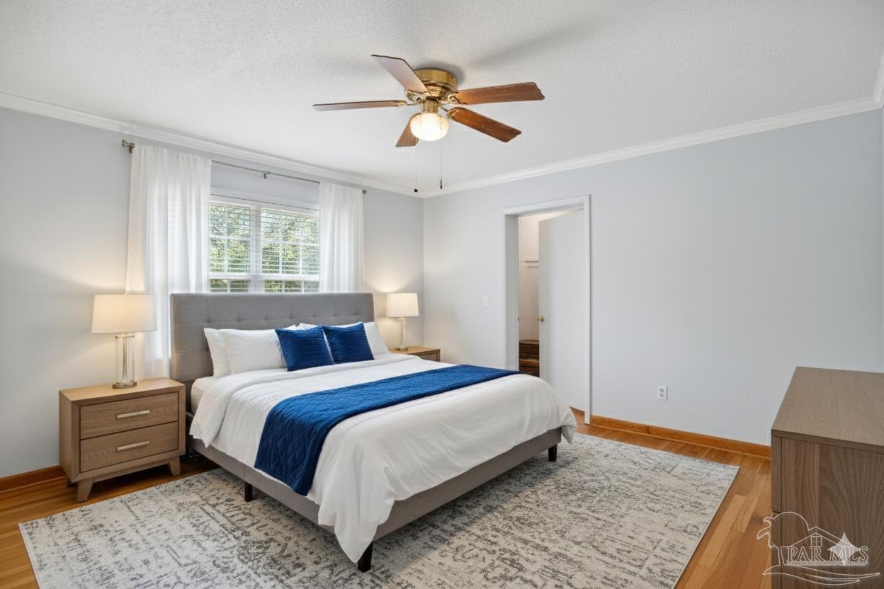 533 Ditmar Street Pensacola, FL 32503 - Photo 20 of 37 a bedroom with a bed and a dresser