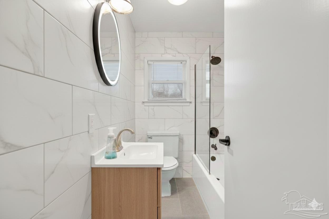 533 Ditmar Street Pensacola, FL 32503 - Photo 25 of 37 a bathroom with a sink a toilet and shower