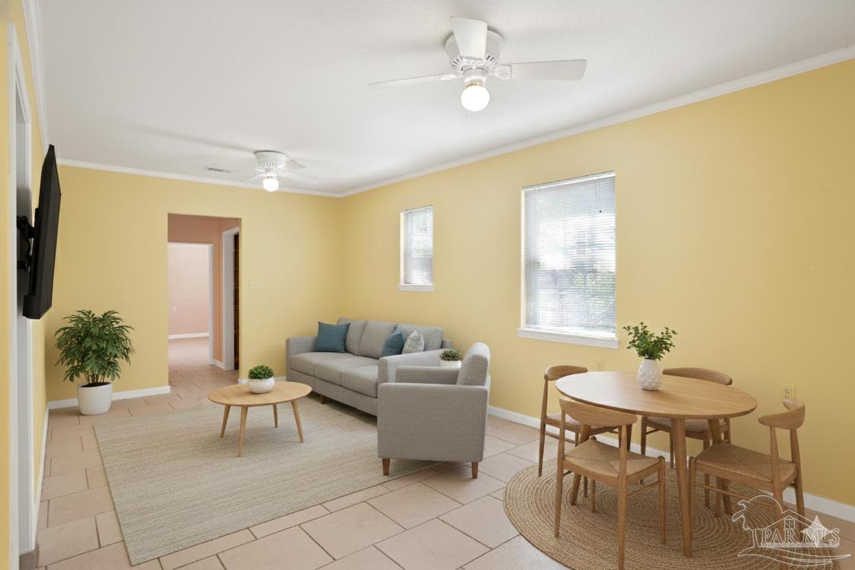 533 Ditmar Street Pensacola, FL 32503 - Photo 31 of 37 a living room with furniture and a chandelier