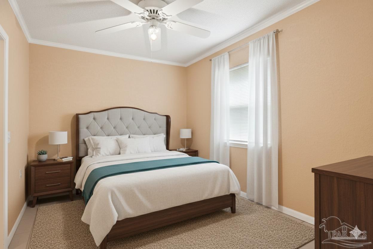 533 Ditmar Street Pensacola, FL 32503 - Photo 34 of 37 a bedroom with a bed and a chandelier