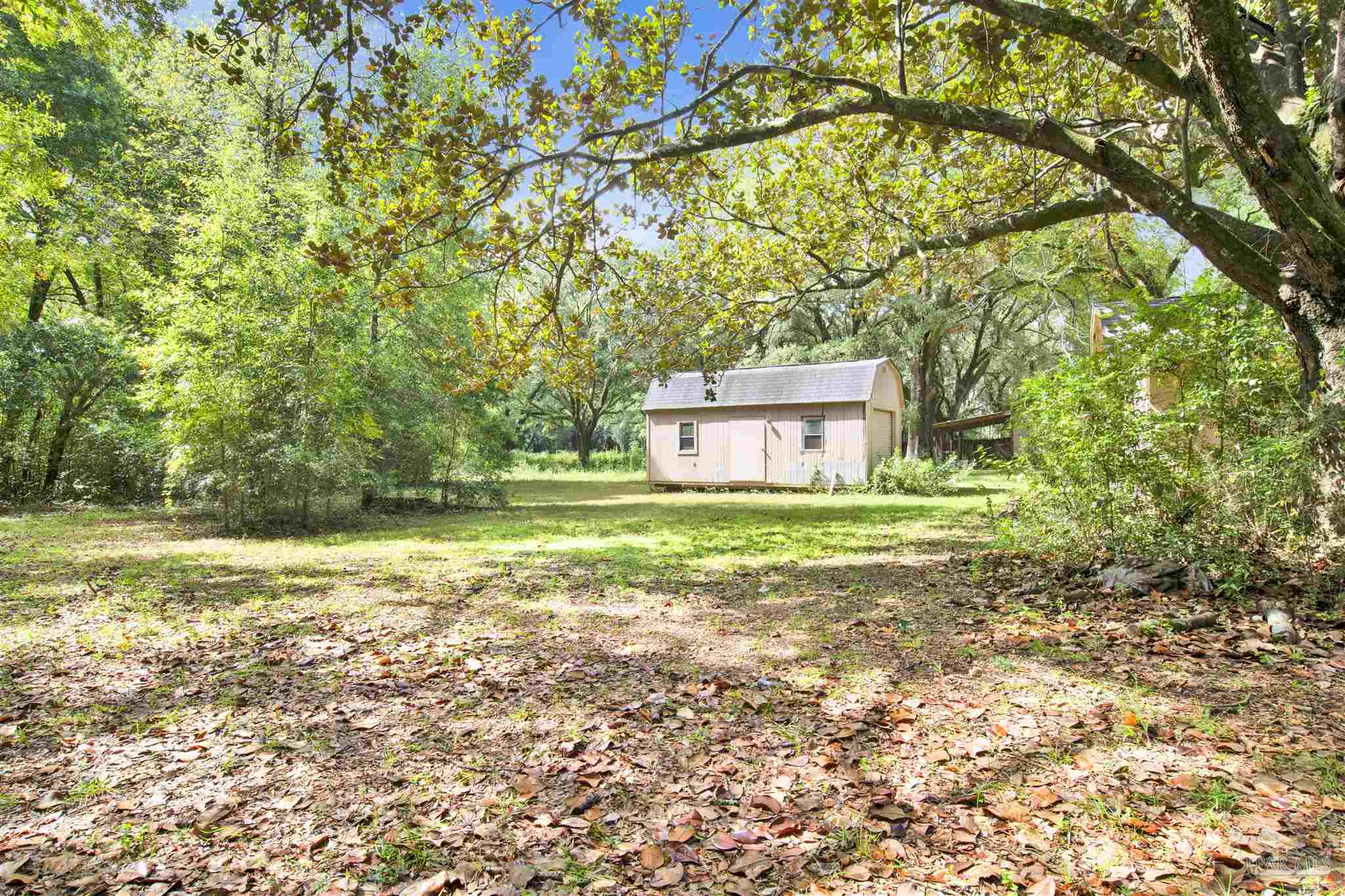 533 Ditmar Street Pensacola, FL 32503 - Photo 36 of 37 a view of a trees with a yard