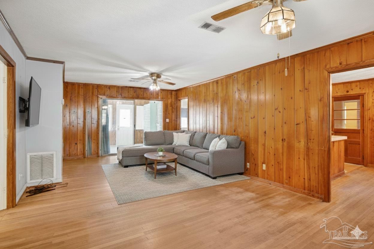 533 Ditmar Street Pensacola, FL 32503 - Photo 8 of 37 a living room with furniture window and wooden floor