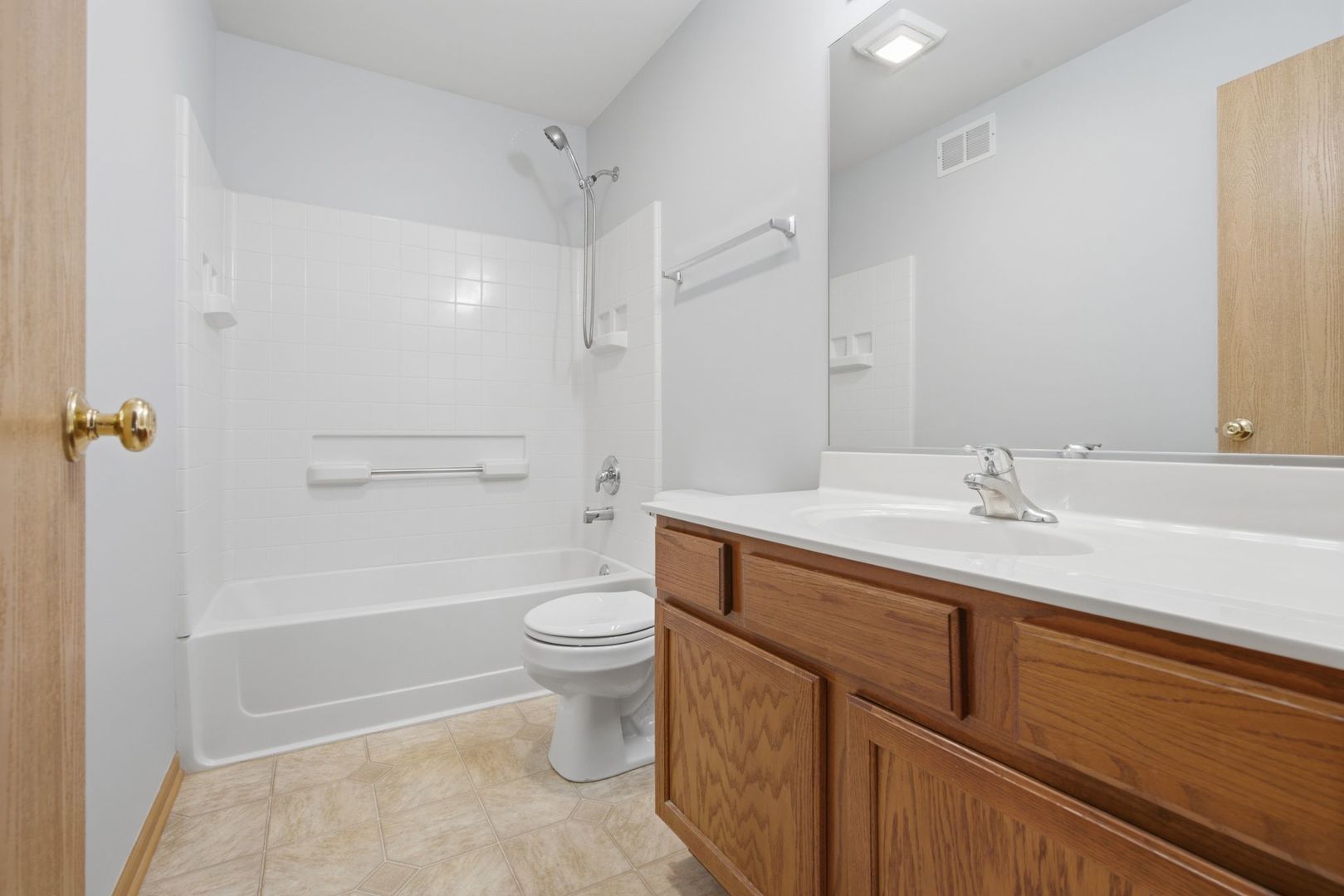 1758 Edith Lane Aurora, IL 60504 - Photo 19 of 28 a bathroom with a sink a toilet and shower