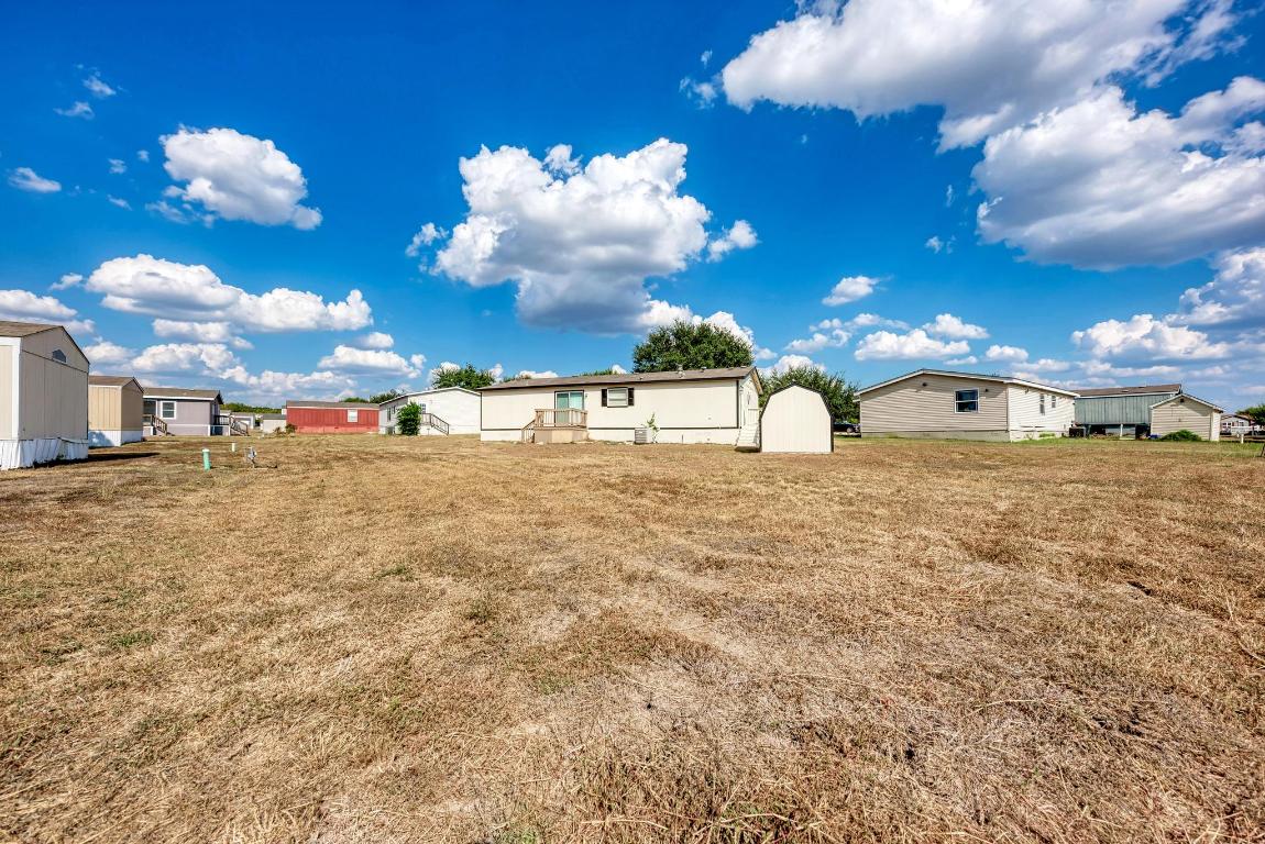 187 Horseshoe Bend Road San Marcos, TX 78666 - Photo 30 of 38 View of grassy yard with a residential view