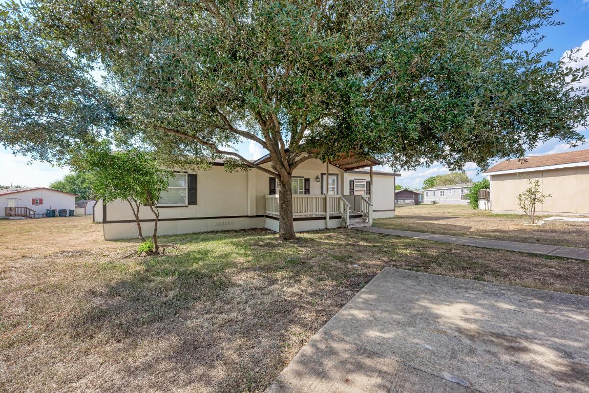 187 Horseshoe Bend Road San Marcos, TX 78666 - Photo 4 of 38 View of front of home featuring a front yard and a deck