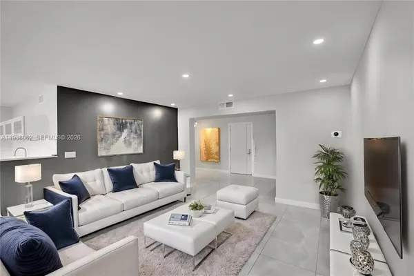 a view of a kitchen with fridge and rack