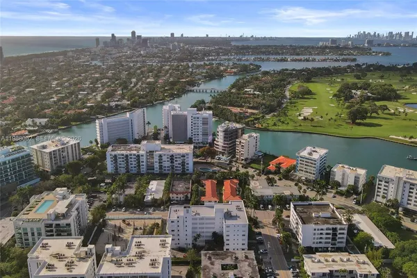an aerial view of a city with ocean view