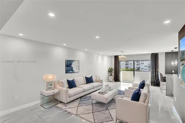 a living room with furniture and a large window