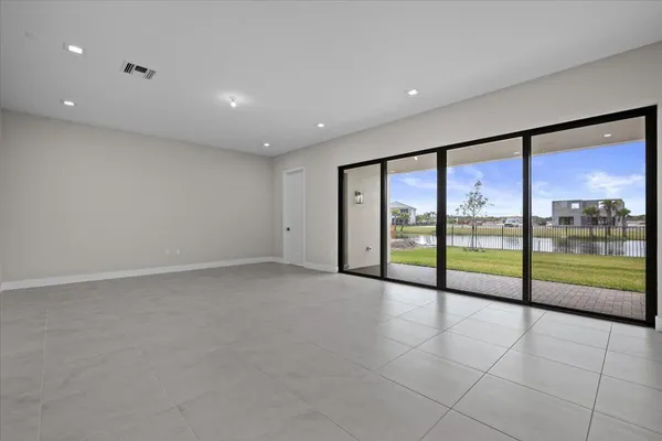 a view of an empty room with glass windows