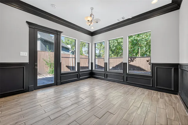 a view of room with window and hardwood floor