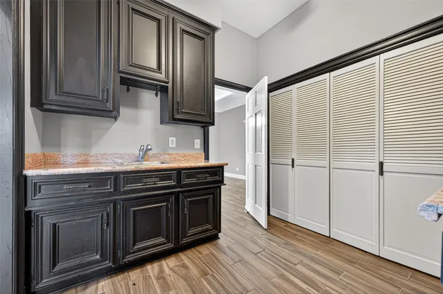 a kitchen with stainless steel appliances granite countertop a stove and a sink