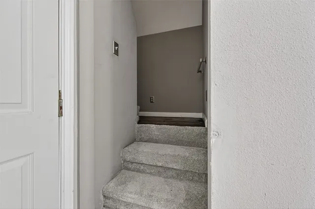 a bathroom with a granite countertop sink