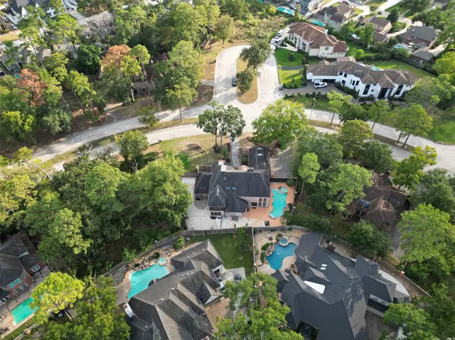 an aerial view of a house with outdoor space