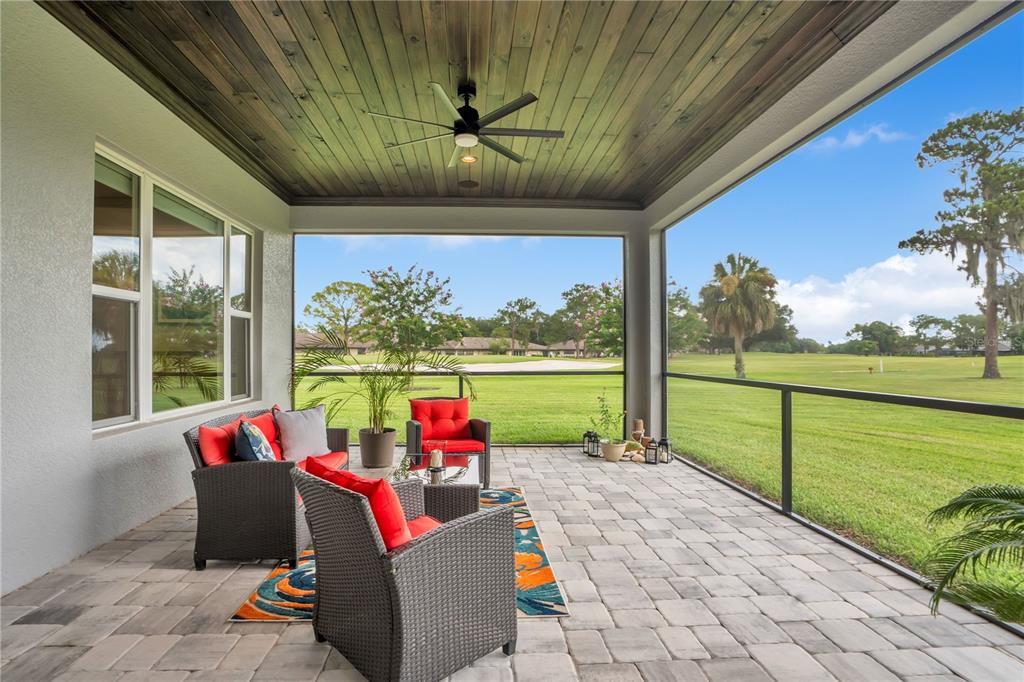440 Palma Ceia Road Winter Haven, FL 33884 - Photo 56 of 78 a living room with patio furniture and a floor to ceiling window