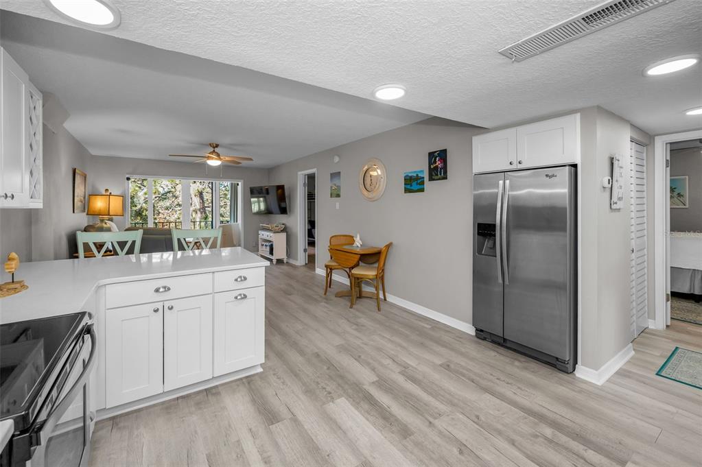 203 Tarpon Point, Unit 203 Tarpon Springs, FL 34689 - Photo 17 of 39 a kitchen with stainless steel appliances a refrigerator and a stove top oven