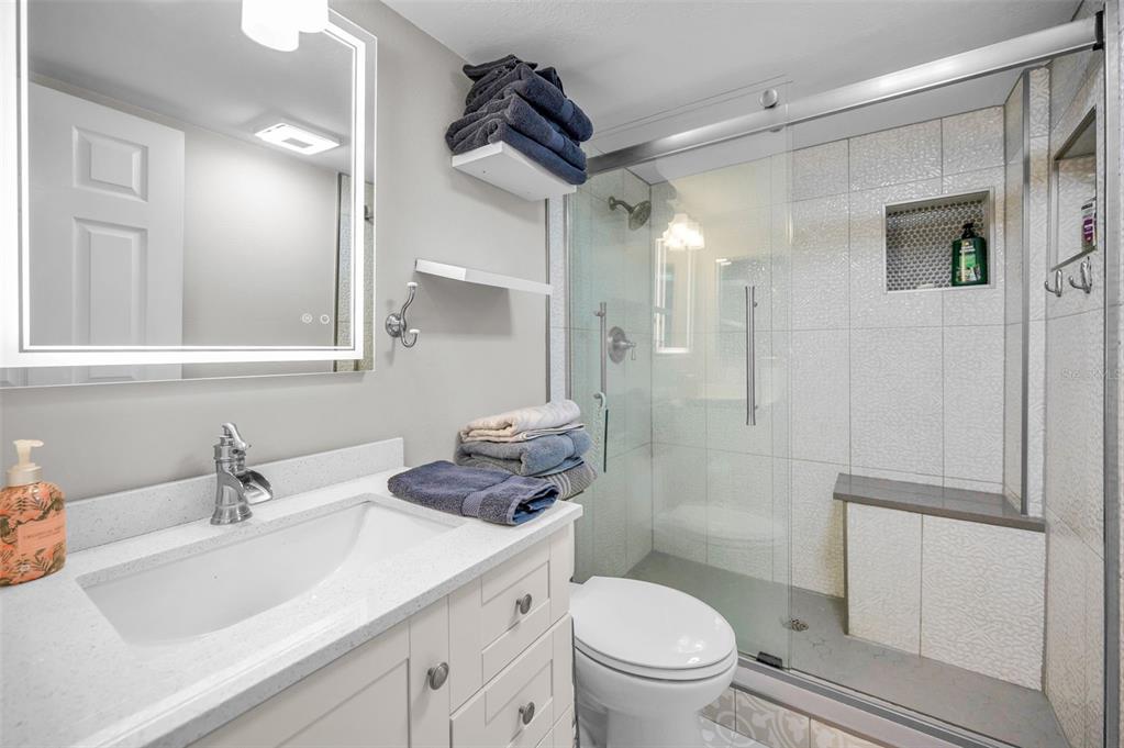 203 Tarpon Point, Unit 203 Tarpon Springs, FL 34689 - Photo 24 of 39 a bathroom with a sink toilet and shower