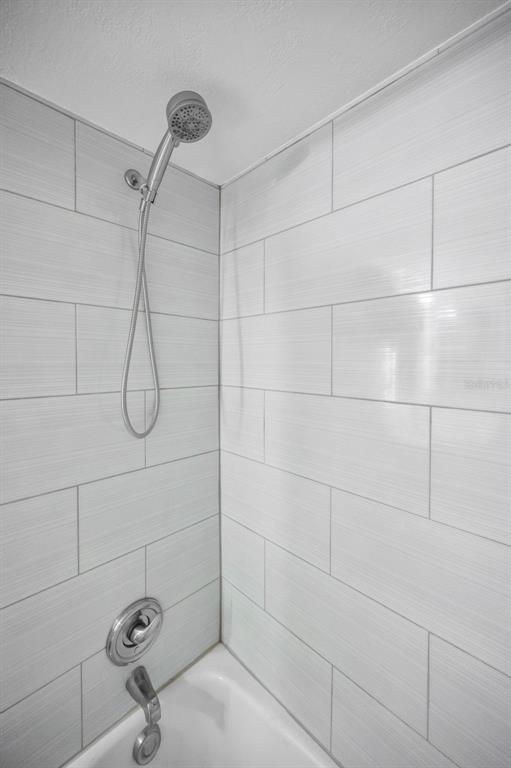 203 Tarpon Point, Unit 203 Tarpon Springs, FL 34689 - Photo 30 of 39 a bathroom with a shower