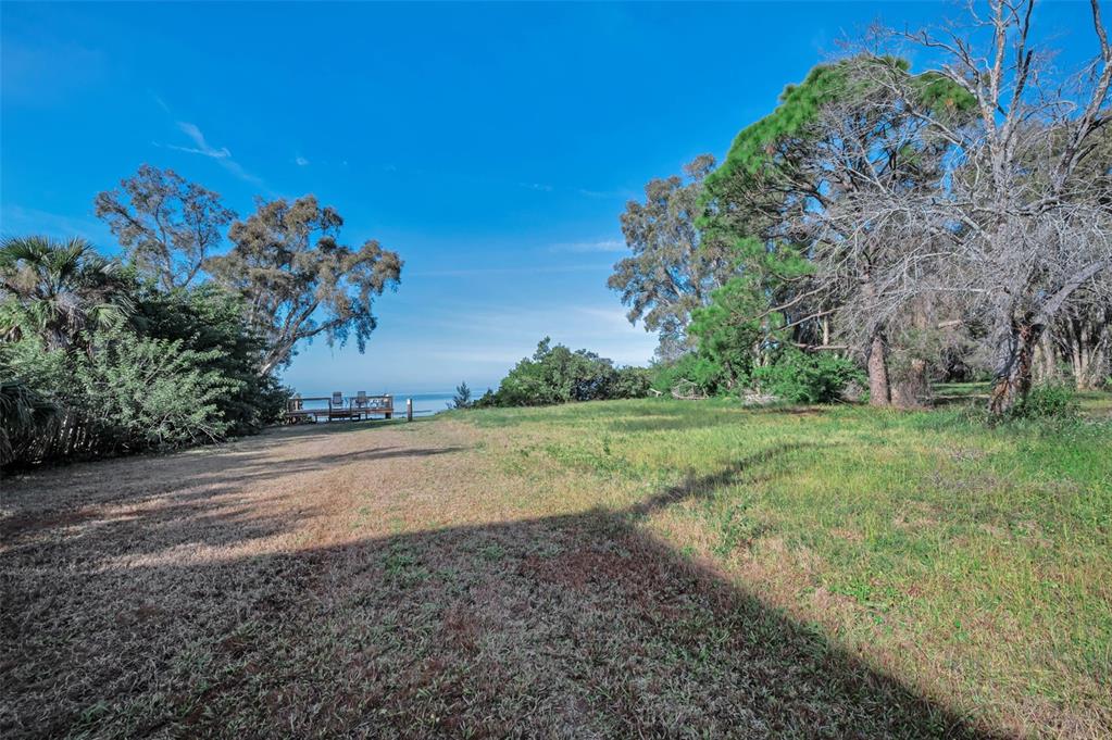 203 Tarpon Point, Unit 203 Tarpon Springs, FL 34689 - Photo 36 of 39 a view of a field with large trees