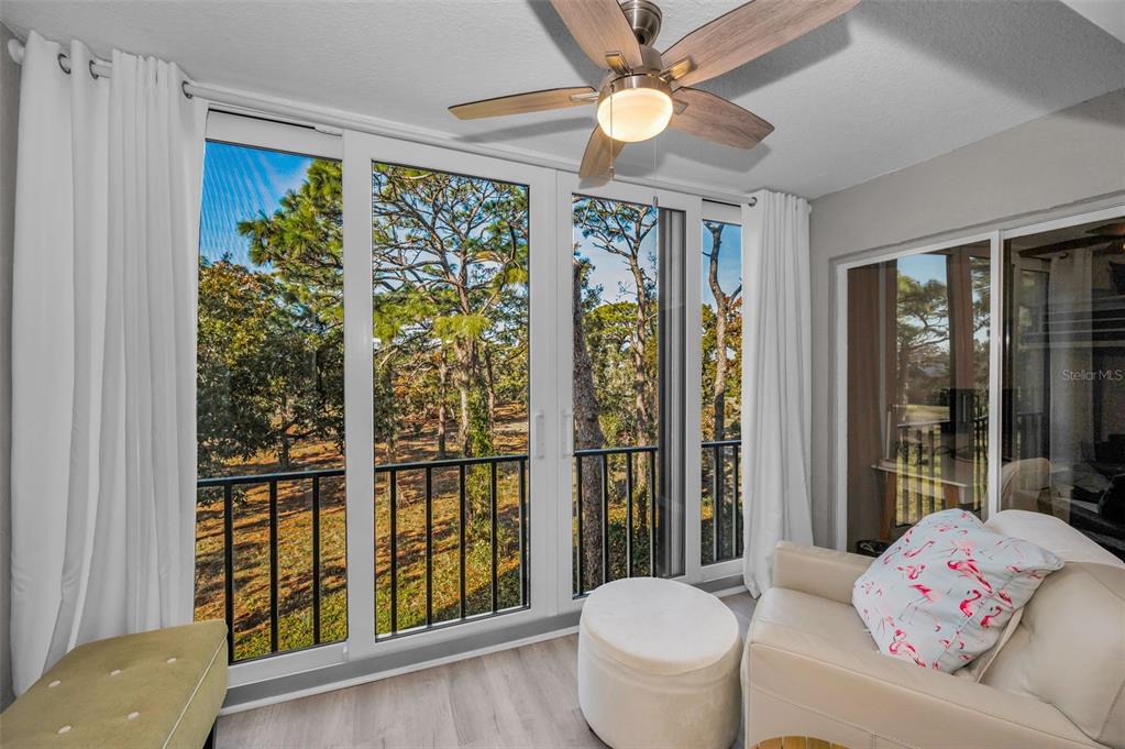 203 Tarpon Point, Unit 203 Tarpon Springs, FL 34689 - Photo 6 of 39 a living room with furniture and a large window