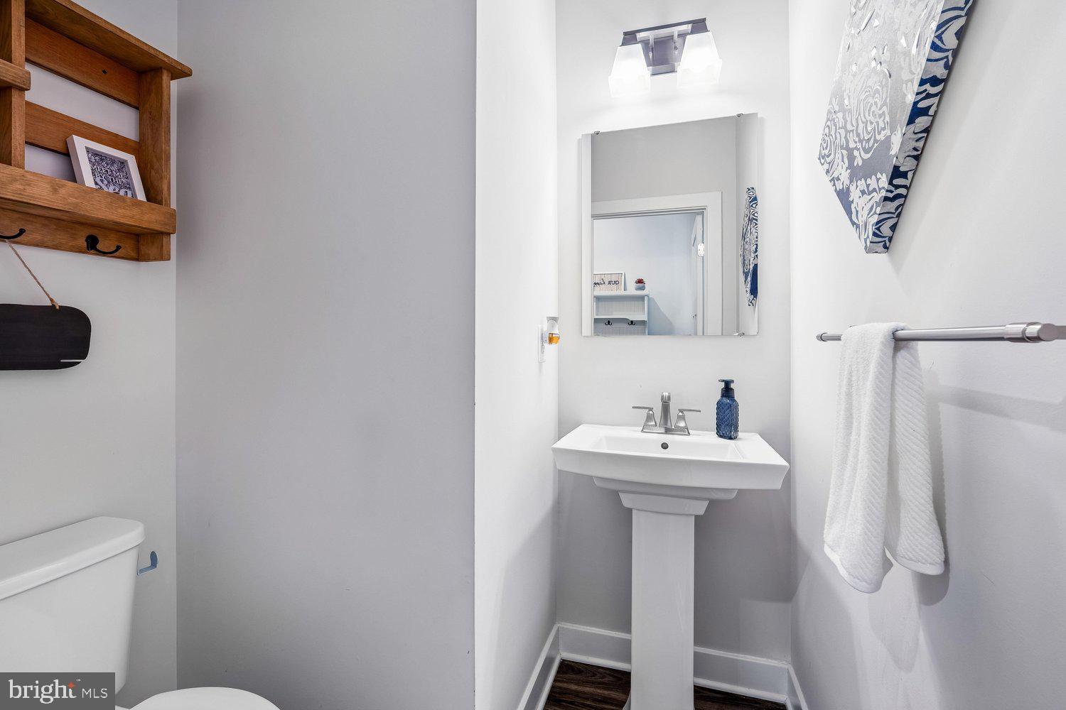 1275 Upper Patuxent Ridge Road Odenton, MD 21113 - Photo 38 of 107 POWDER RM W/ PEDESTAL SINK & LVP FLOORING
