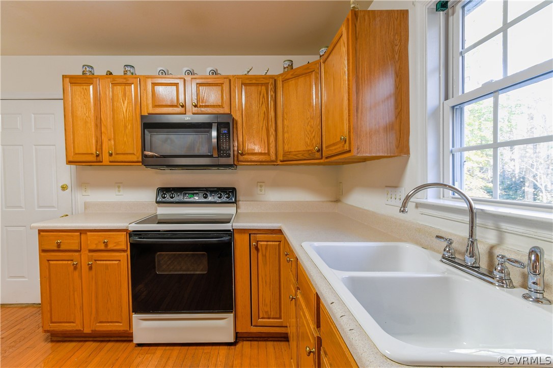 3833 Dunraven Road Chesterfield, VA 23236 - Photo 12 of 39 a kitchen with a sink a stove and microwave